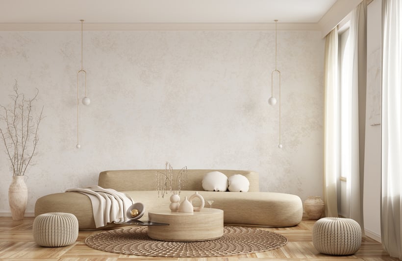 Modern interior design of apartment, living room with beige sofa over the light stucco wall